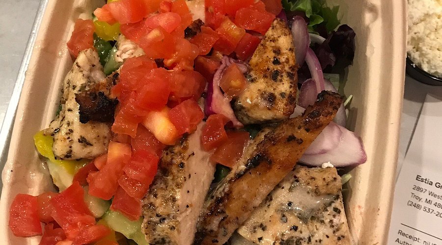Estia Greek Street Food signature dishes Traditional Gyro (pork or chicken), Build-Your-Own Pita, Greek Fries, Horiatiki Salad